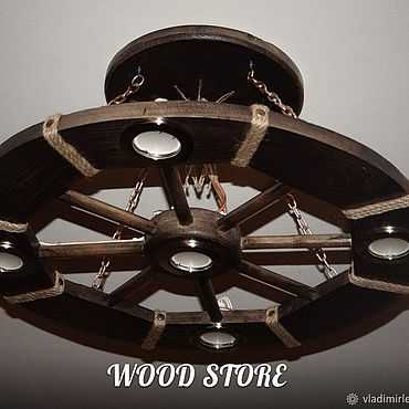 Люстры в виде колеса (24 фото): модели в форме деревянного колеса от телеги
